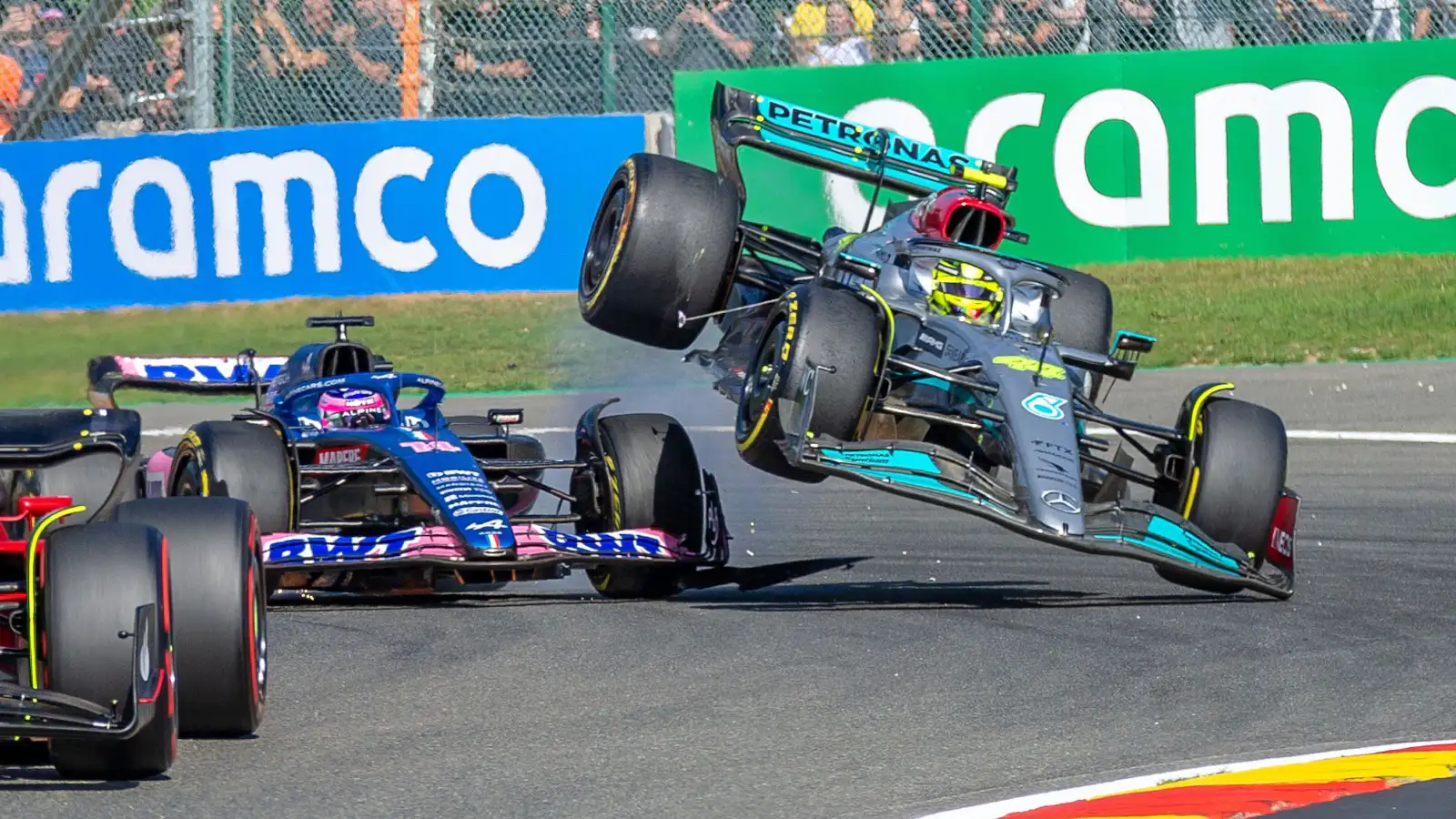 Lewis Hamilton is sent flying after hitting Fernando Alonso on the opening lap. Belgium August 2022