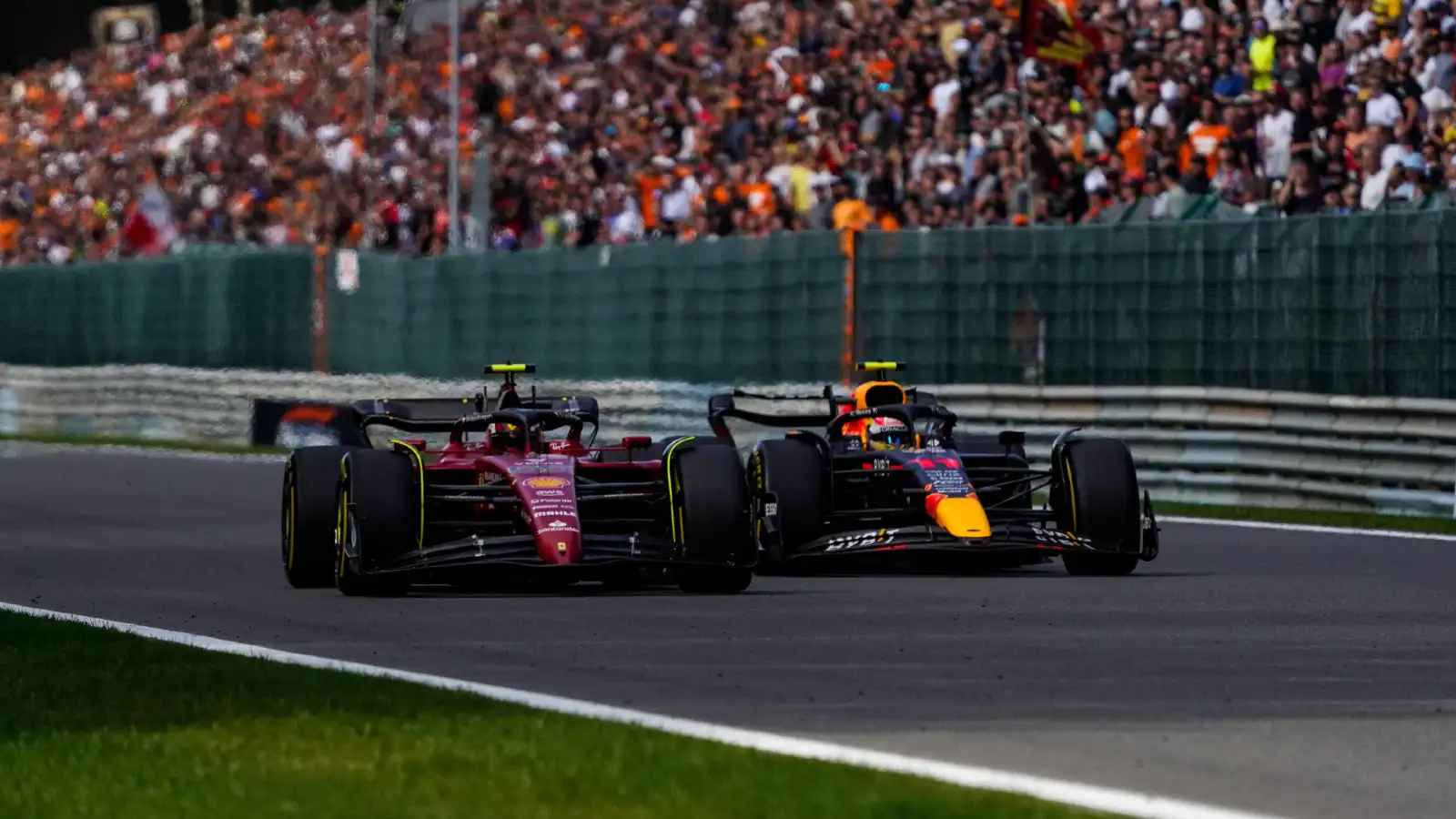 Ferrari's Carlos Sainz & Red Bull's Max Verstappen race at Spa-Francorchamps, August 2022. FIA