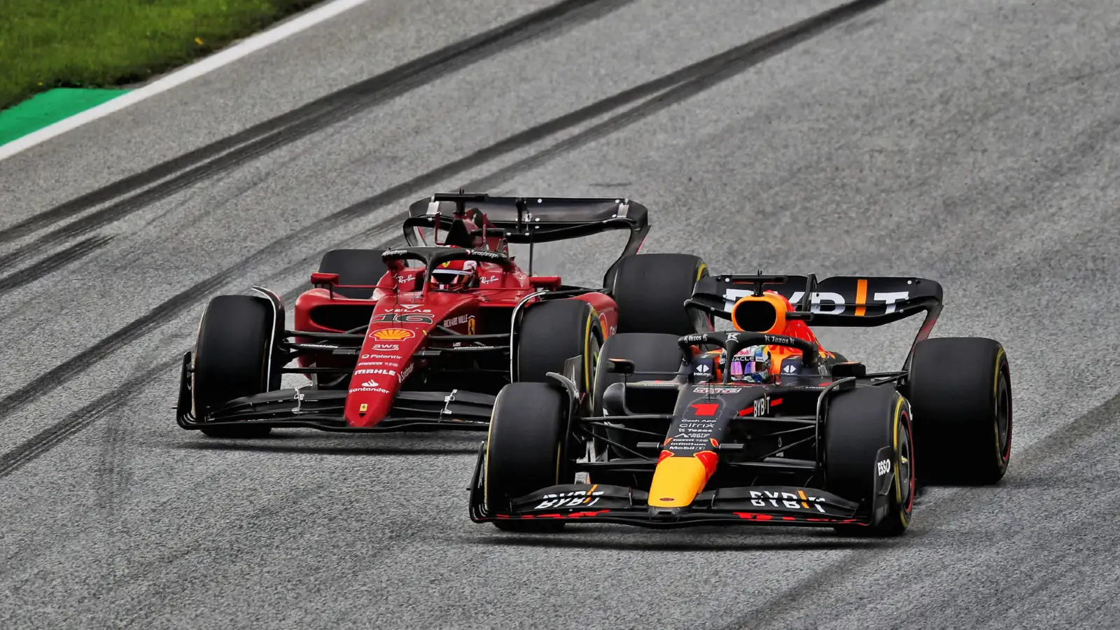 Red Bull driver Max Verstappen tries to fend off Ferrari driver Charles Leclerc at the Austrian Grand Prix. Spielberg, July 2022.