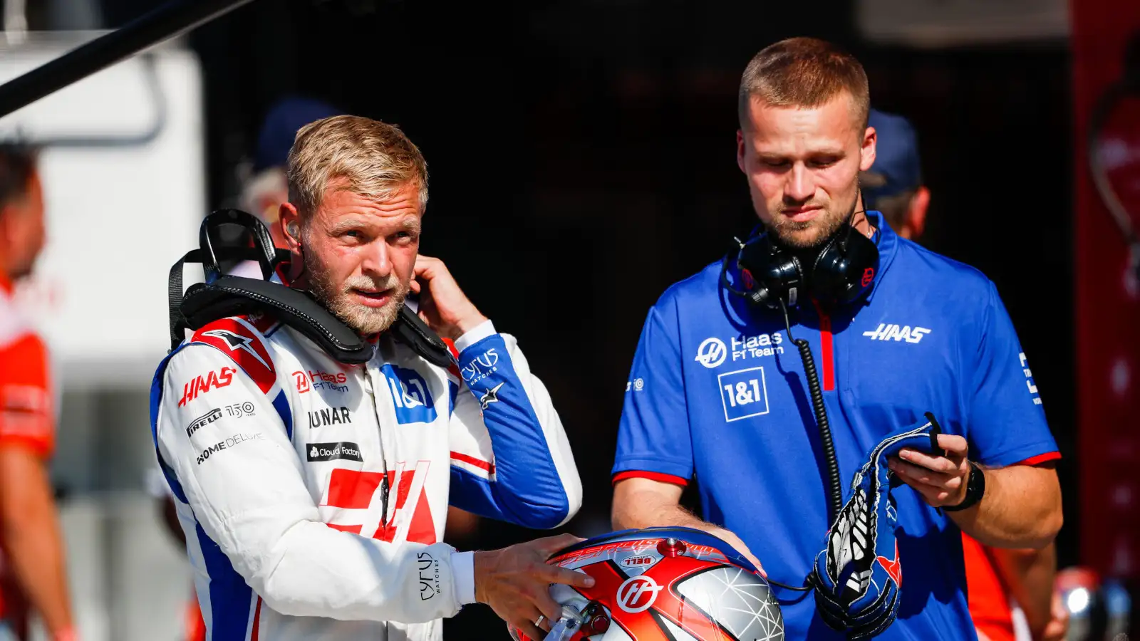 Kevin Magnussen putting on his HANS ahead of a grand prix. Netherlands September 2022