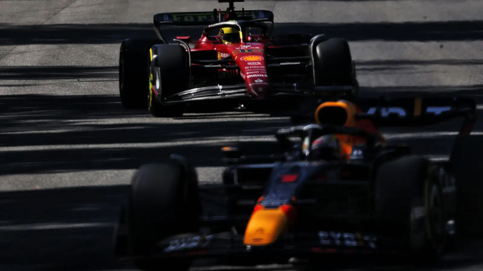 Charles Leclerc, Ferrari, with Red Bull's Max Verstappen on track at the Italian Grand Prix. Monza, September 2022.