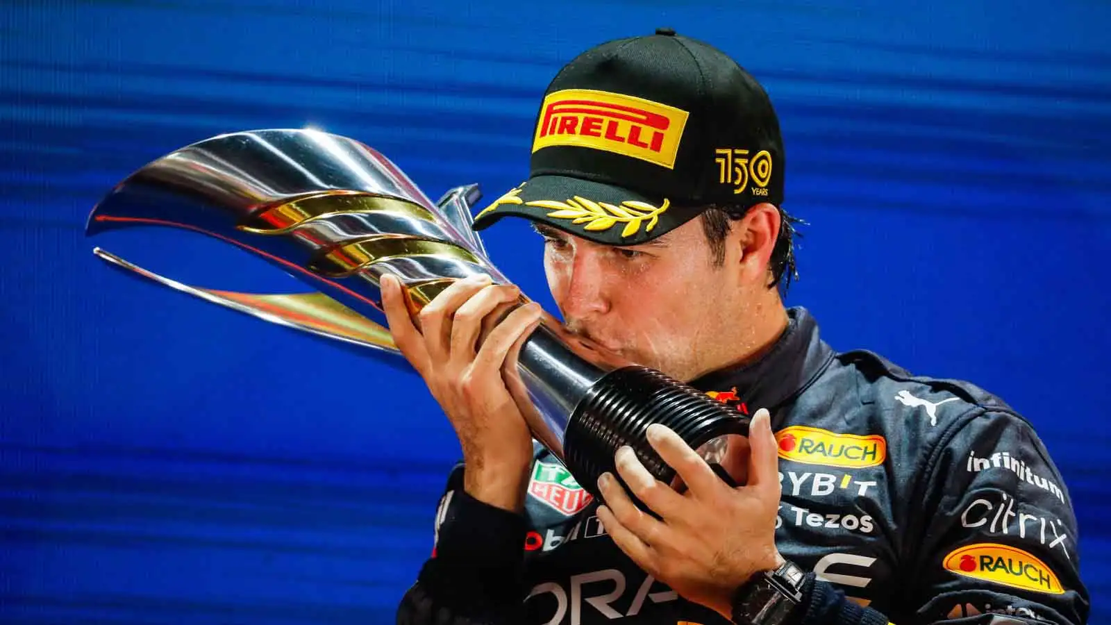 Sergio Perez kisses the trophy. Singapore October 2022.