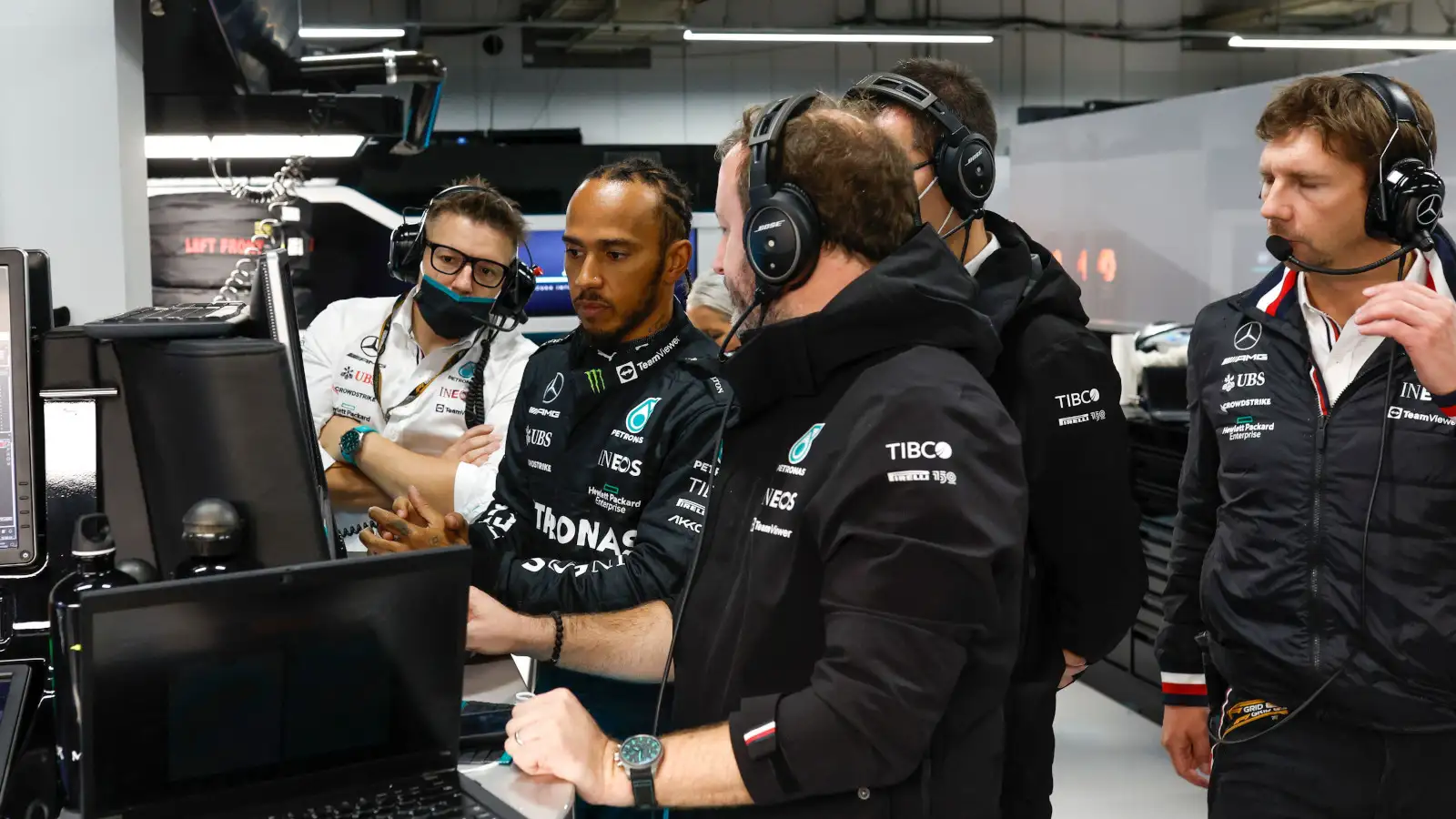 Lewis Hamilton looking at the screens in the Mercedes garage. Japan October 2022