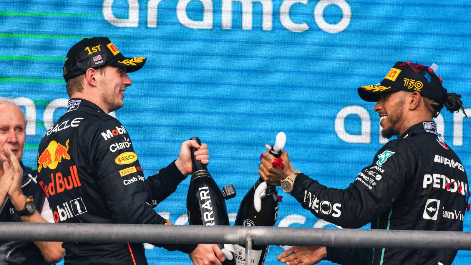 Max Verstappen and Lewis Hamilton clink bottles planetF1
