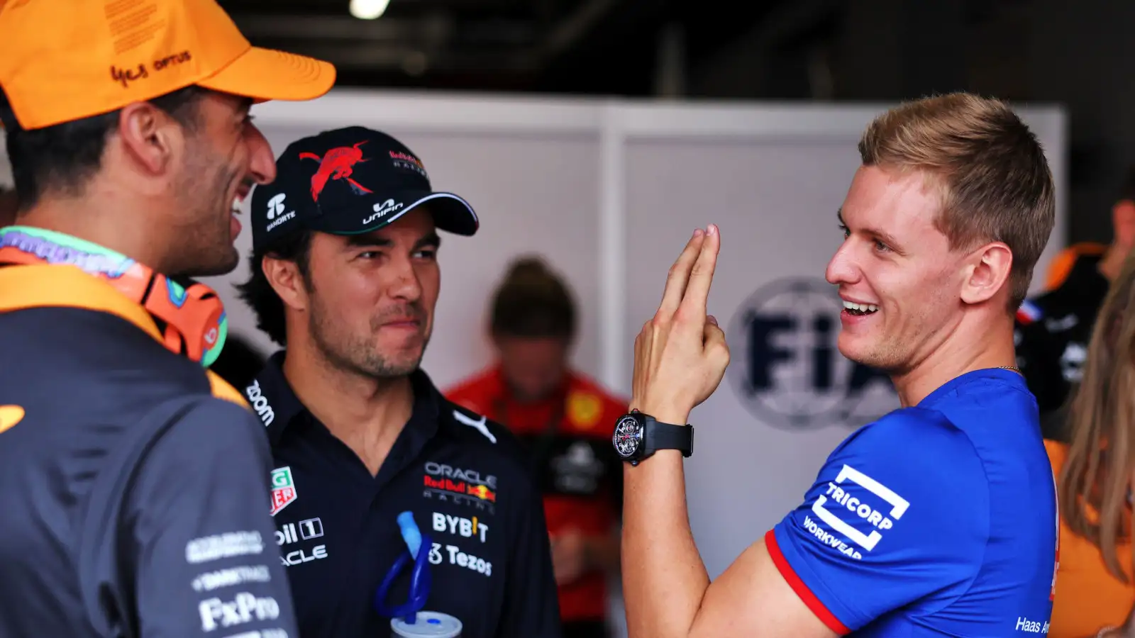 Mick Schumacher speaking with Daniel Ricciardo and Sergio Perez. Netherlands September 2022