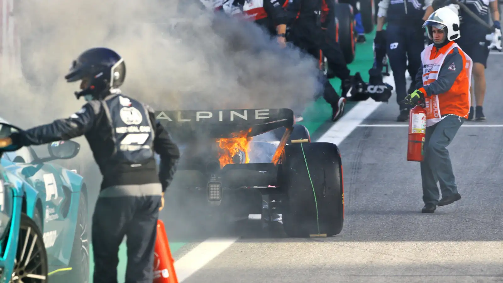 Esteban Ocon Alpine A522 on fire in parc ferme. Brazil November 2022