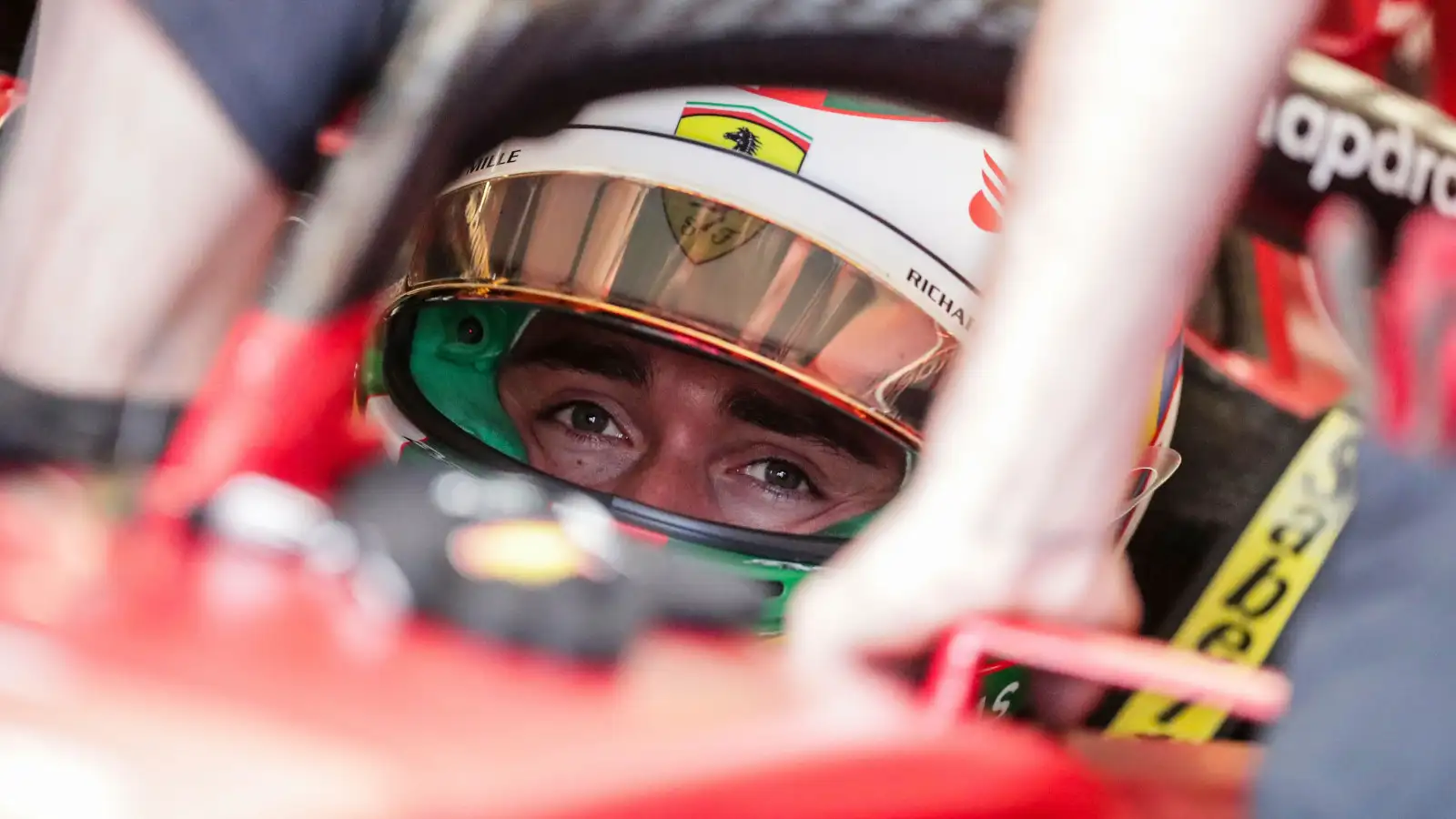 Charles Leclerc up close eyes focused sitting in his Ferrari. Brazil November 2022