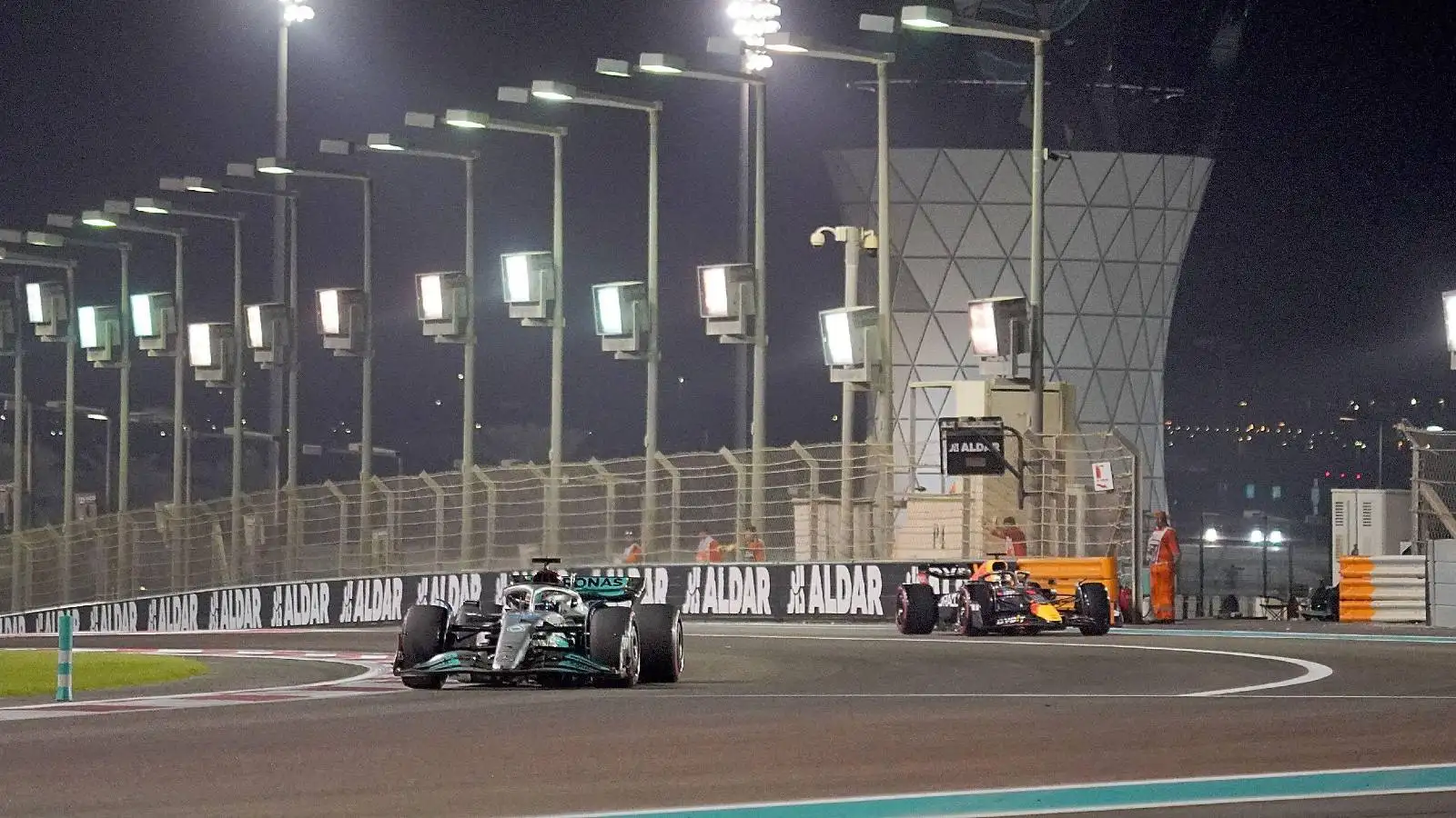 George Russell, Mercedes, followed by Max Verstappen, Red Bull. Abu Dhabi, November 2022.