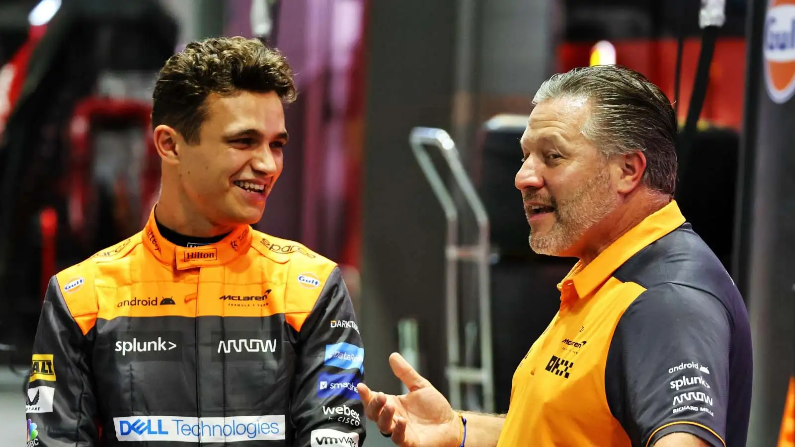 McLaren driver and CEO Lando Norris and Zak Brown stand together. Singapore September 2022.