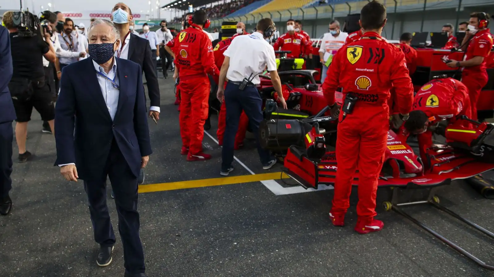 Jean Todt walks past Ferrari on the grid. Qatar, November 2021.