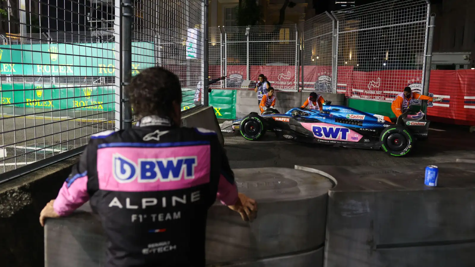 Alpine's Fernando Alonso watches on after retiring from the 2022 Singapore Grand Prix. Marina Bay, September 2022.