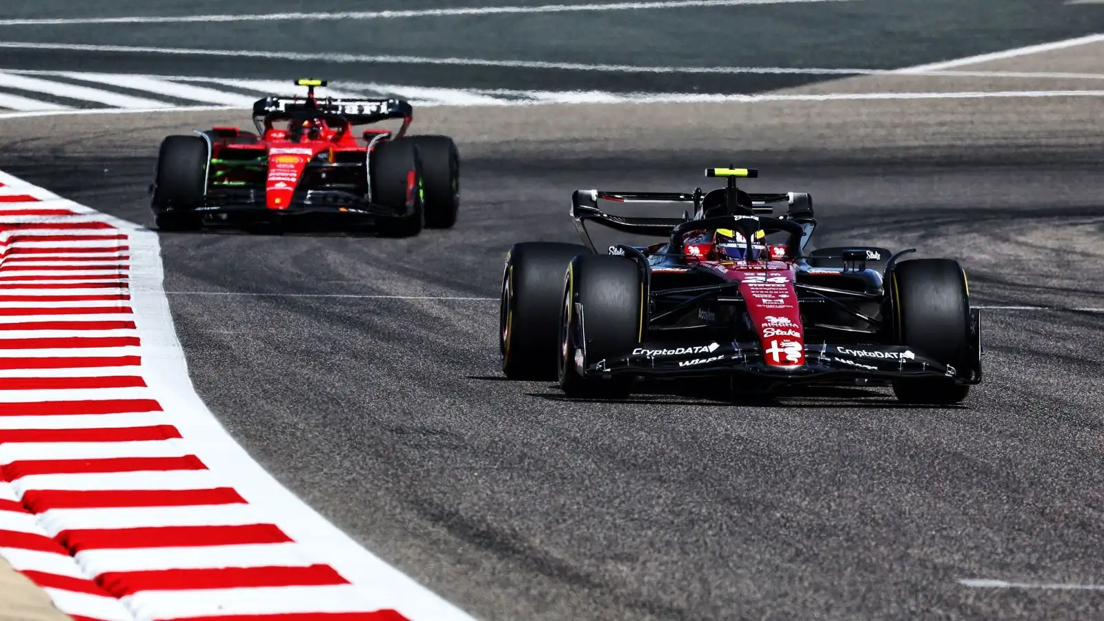 Ferrari following Alfa Romeo. Bahrain, February 2023.