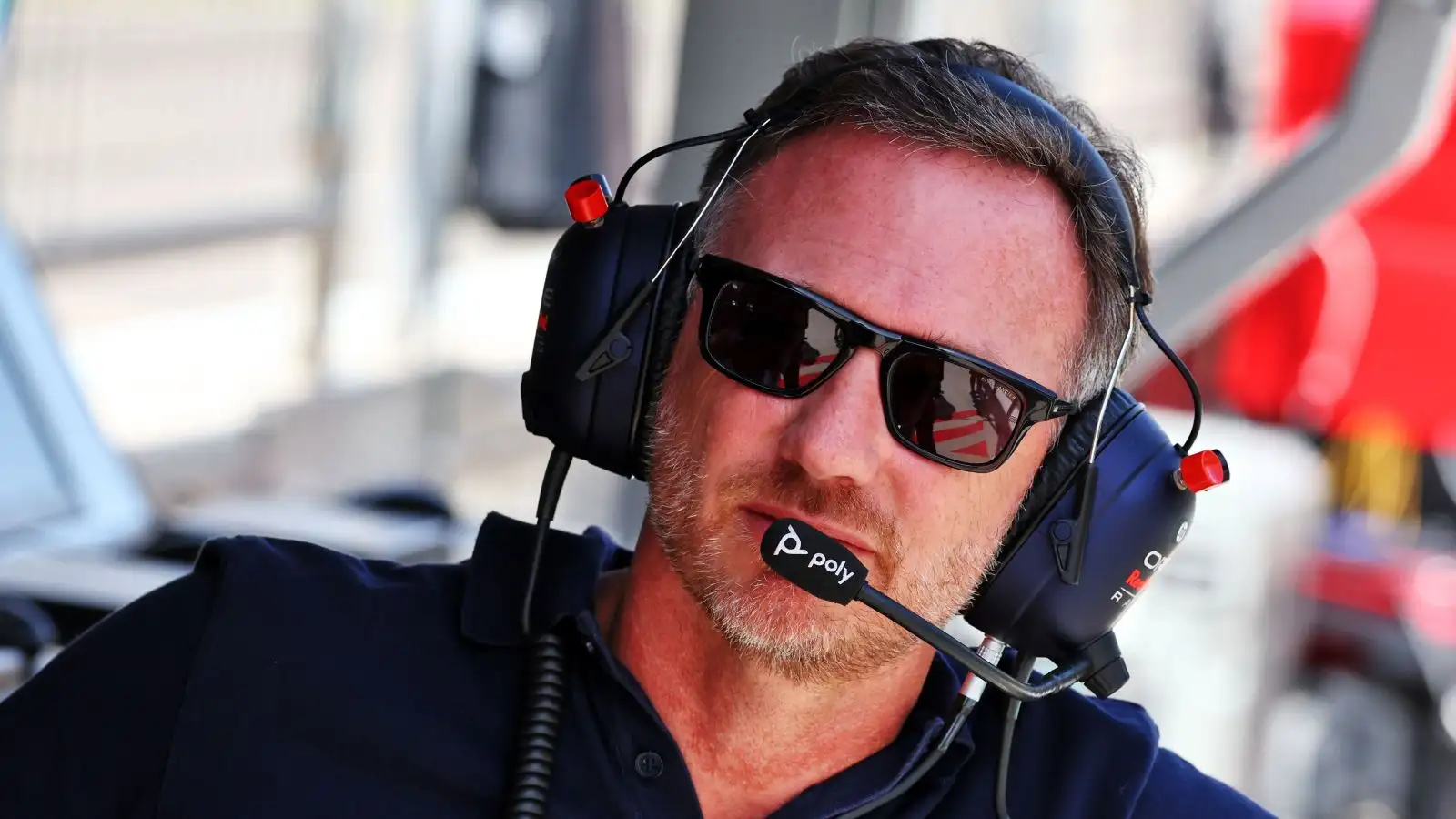 Christian Horner, Red Bull, in sunglasses and headset. Bahrain, February 2023.