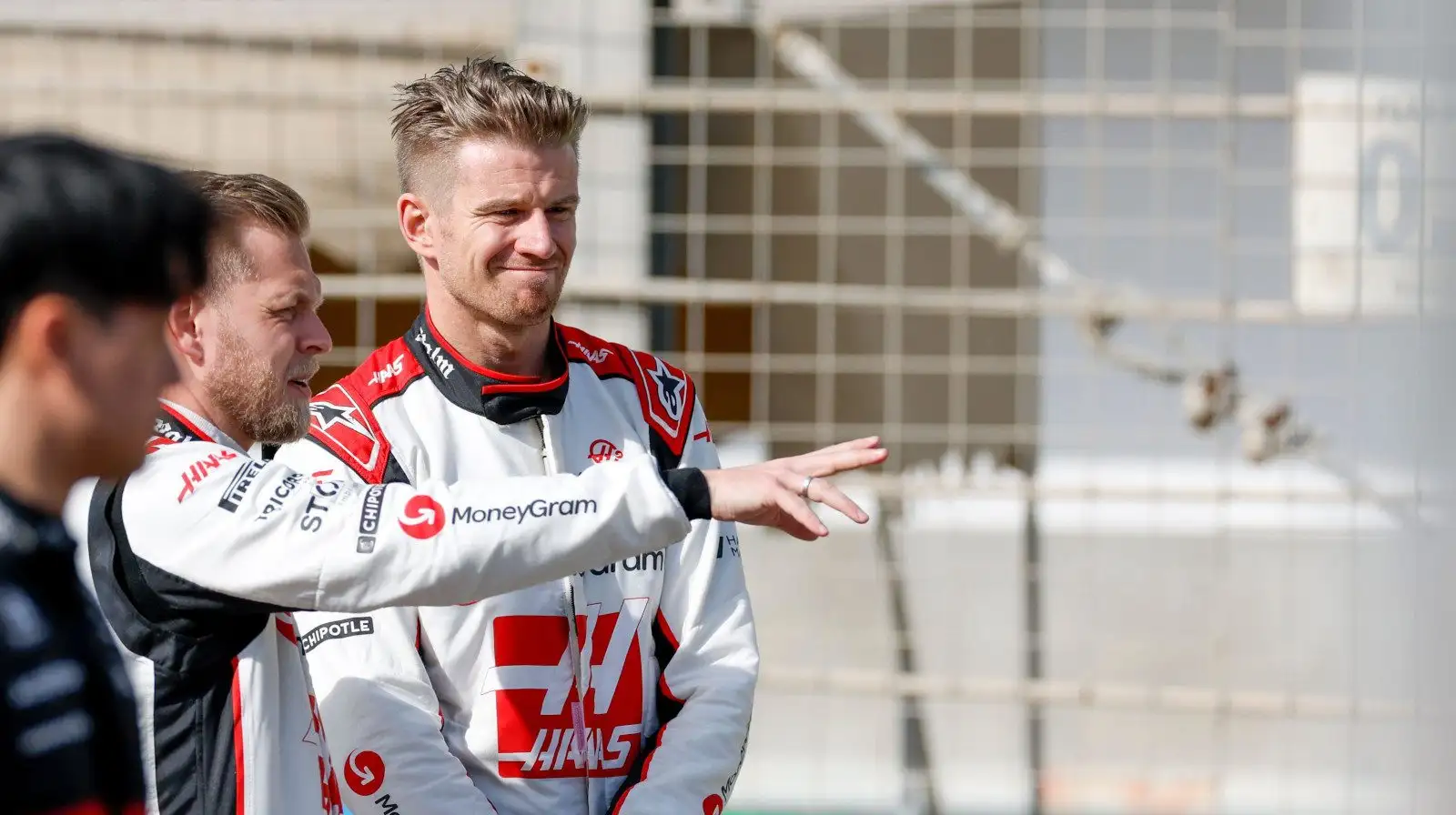 Kevin Magnussen points something out to Nico Hulkenberg. Bahrain February 2023