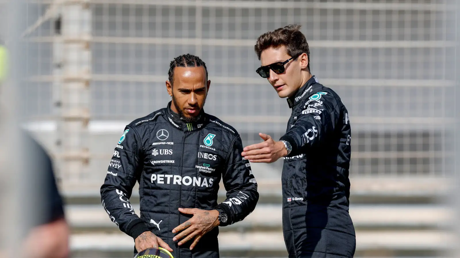 George Russell points something out to Mercedes team-mate Lewis Hamilton. Bahrain February 2023