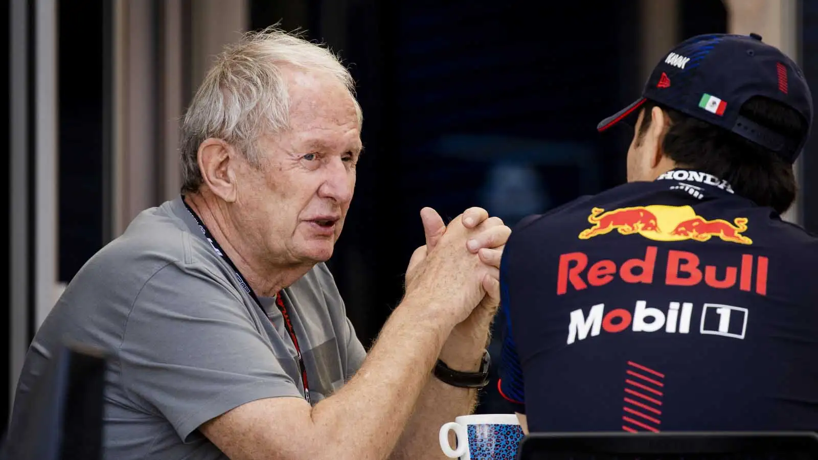Helmut Marko talks to Sergio Perez. Bahrain February 2023.