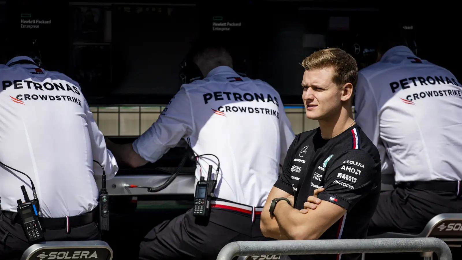 心肌梗死ck Schumacher looking down the pit lane while standing in front of the Mercedes pit wall. Bahrain February 2023