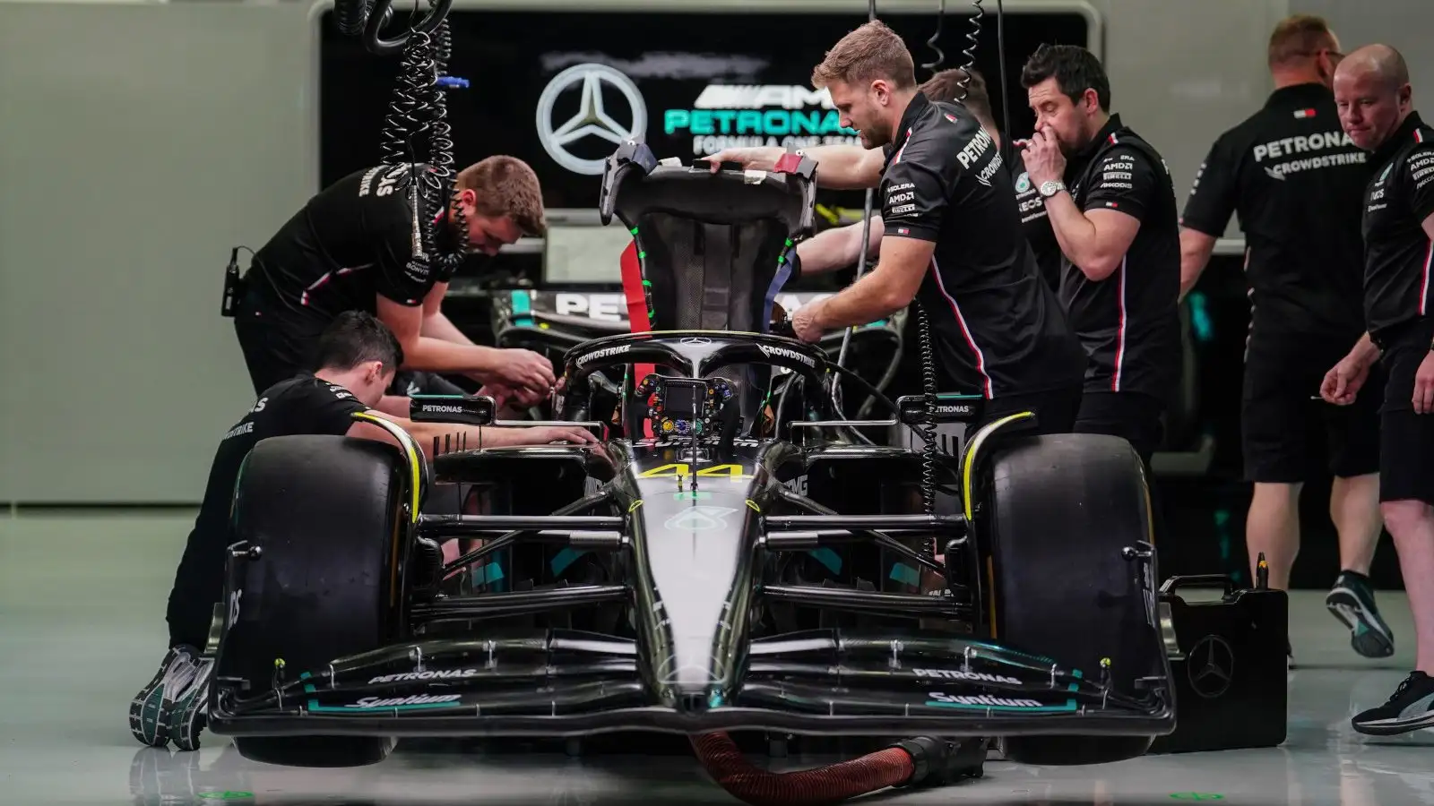 Mercedes mechanics raise the W14's engine cover. Bahrain March 2023