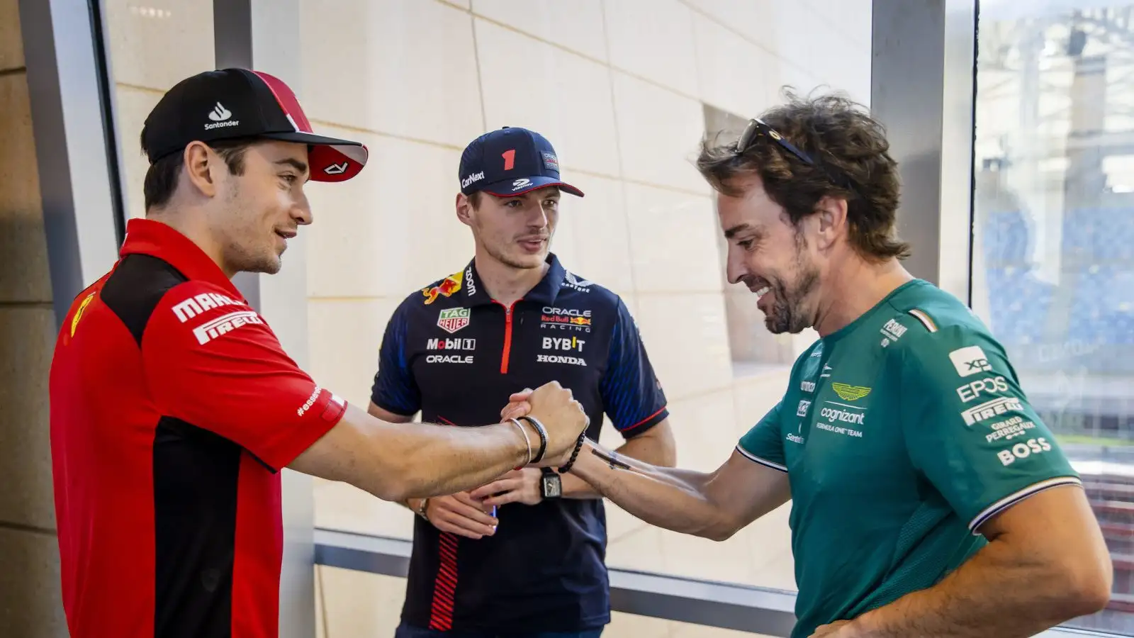 Charles Leclerc greets Fernando Alonso with Max Verstappen also in the photo. Bahrain March 2023