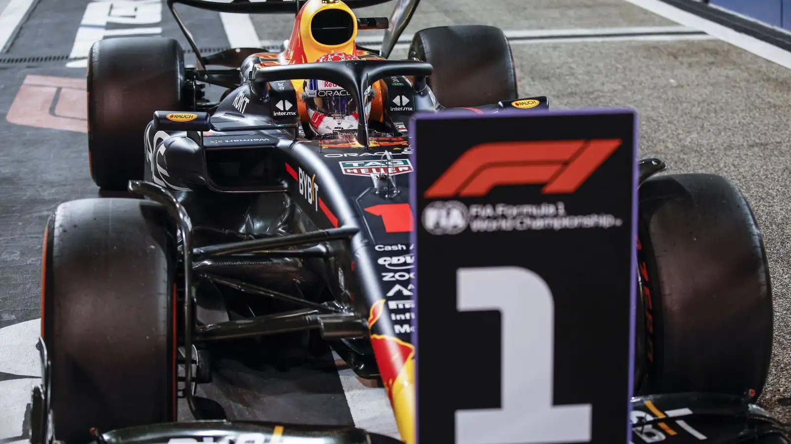 Max Verstappen, Red Bull, in front of the '1' sign. Bahrain, March 2023.