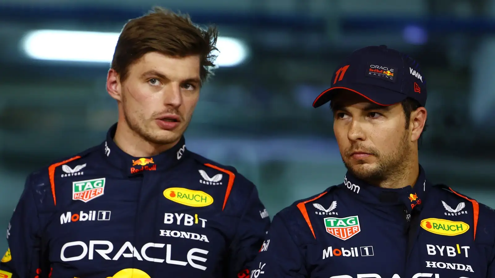 Max Verstappen speaks with Red Bull F1 team-mate Sergio Perez. Bahrain, March 2023.
