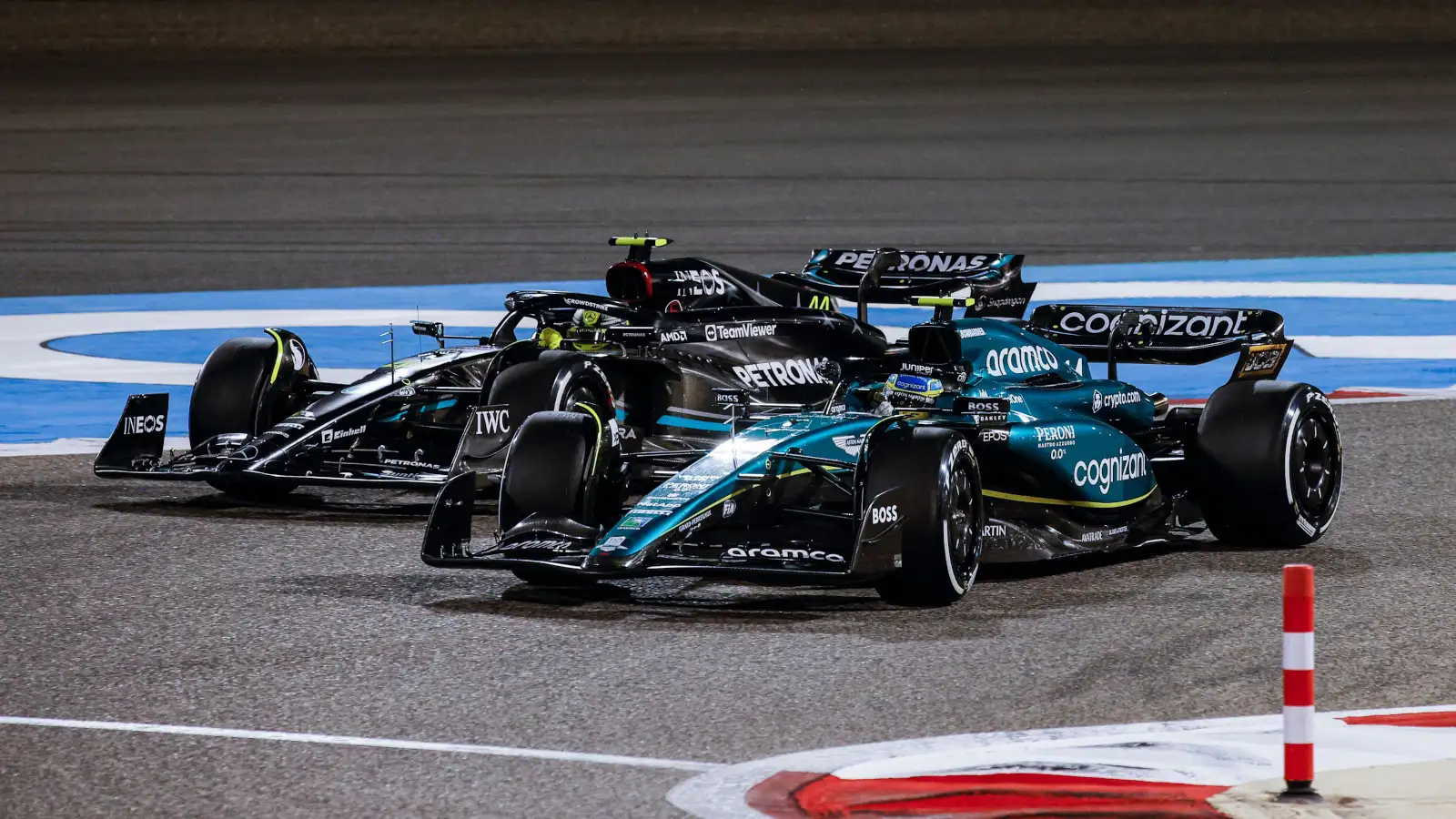 Fernando Alonso racing against Mercedes driver Lewis Hamilton, up the inside. Bahrain March 2023