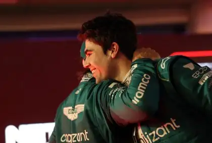 Lance Stroll hugs Fernando Alonso after his podium finish. Bahrain March 2023.