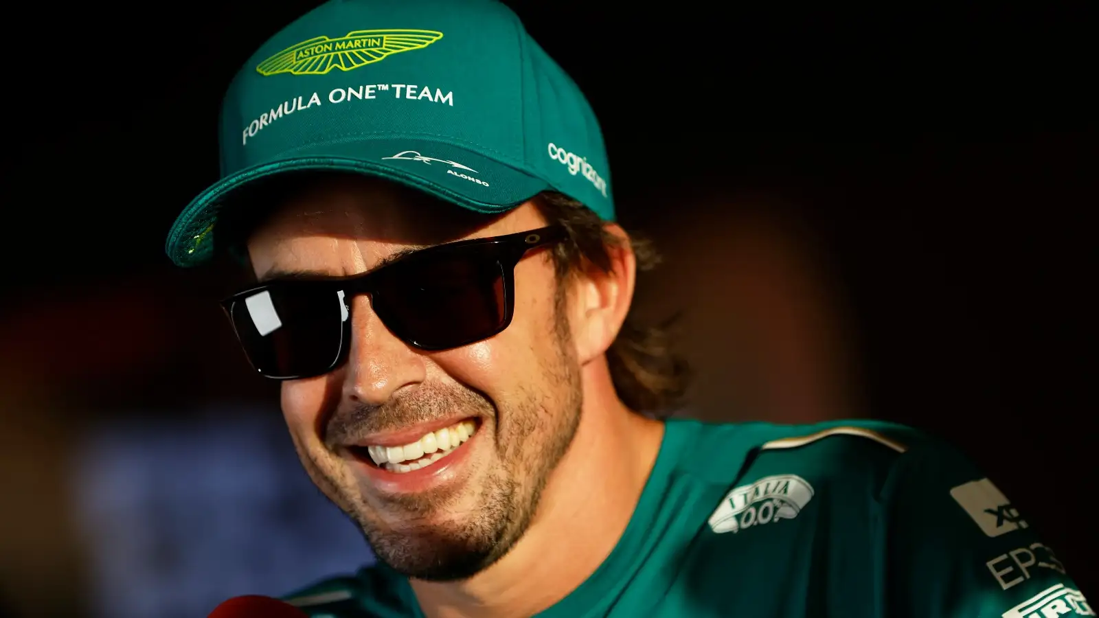 Fernando Alonso smiling wearing sunglasses. Saudi Arabia, March 2023.