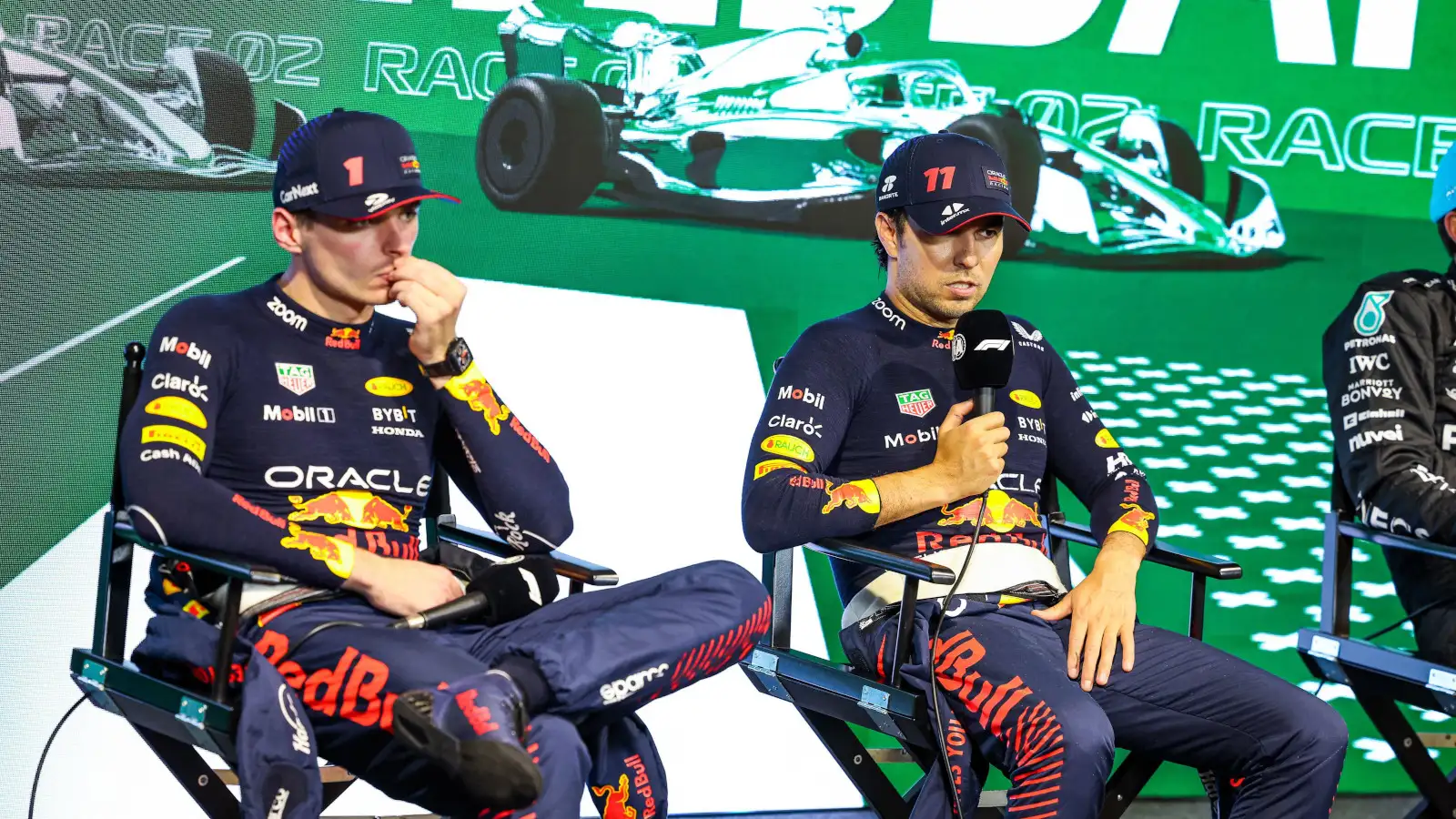 Max Verstappen looking glum in the post-race press conference with Sergio Perez. Saudi Arabia March 2023