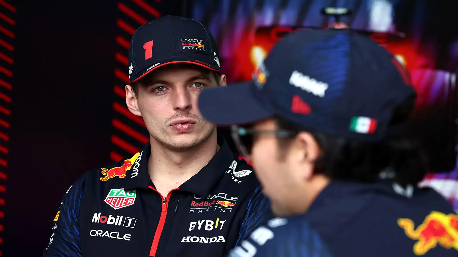 Max Verstappen chats with Sergio Perez in Jeddah. March 2023