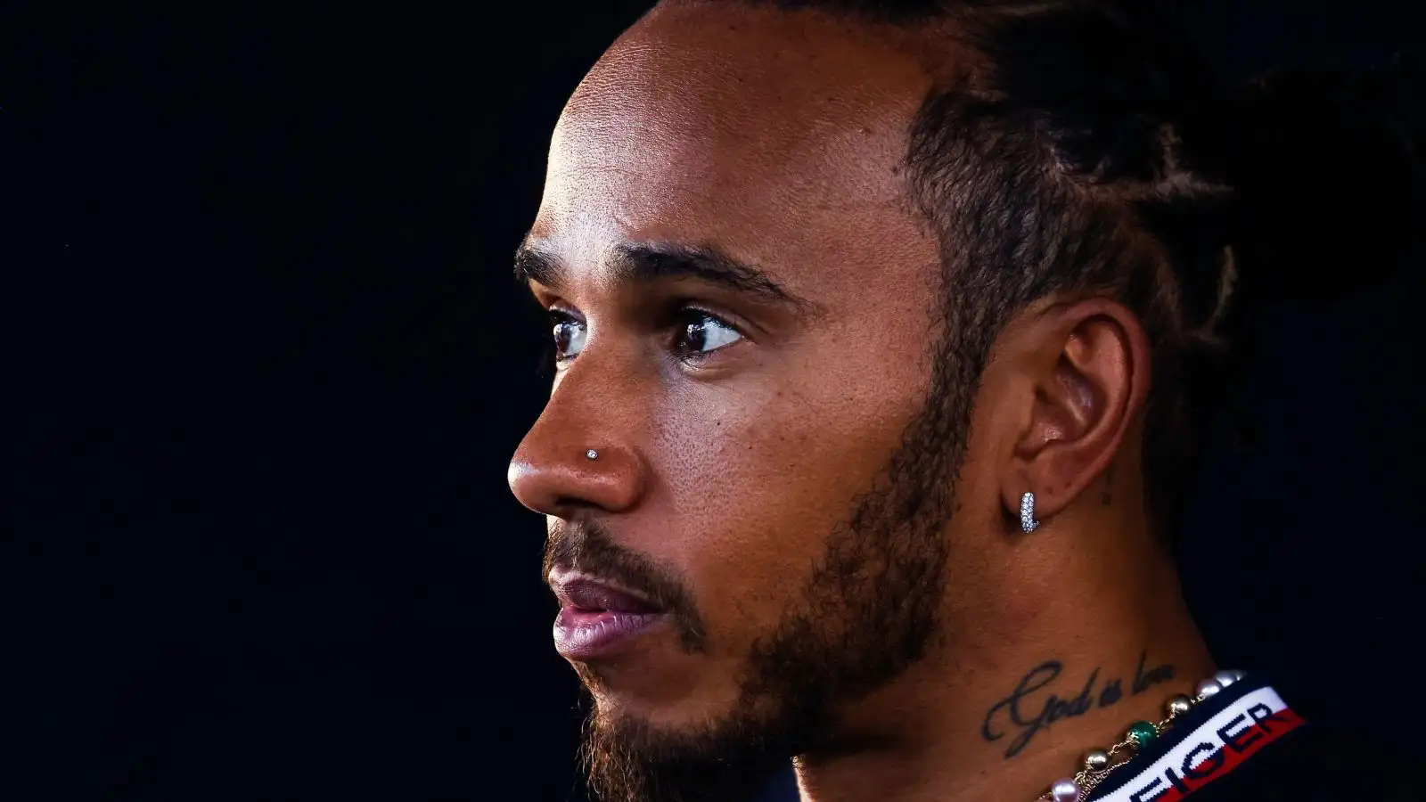 Lewis Hamilton looks concerned.