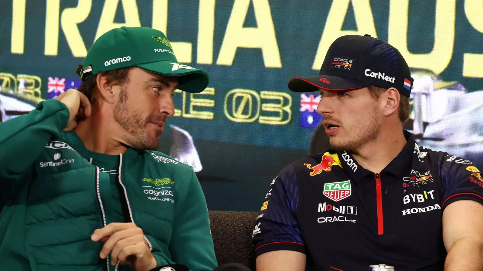 费尔南多-阿隆索chatting to Max Verstappen during the press conference. Australia March 2023