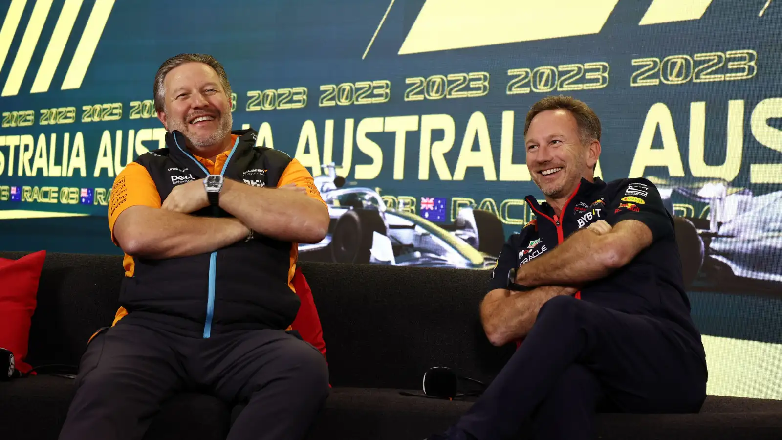 Zak Brown laughing with Christian Horner on the press conference couch. Australia March 2023