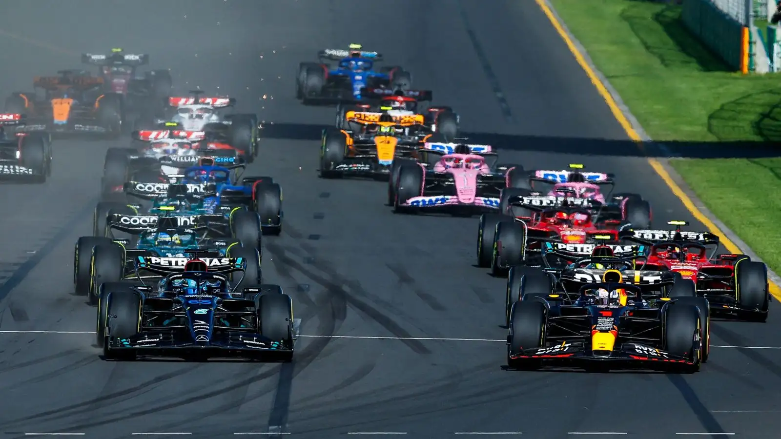 The cars move off the starting grid. Melbourne, Australia. April 2023.