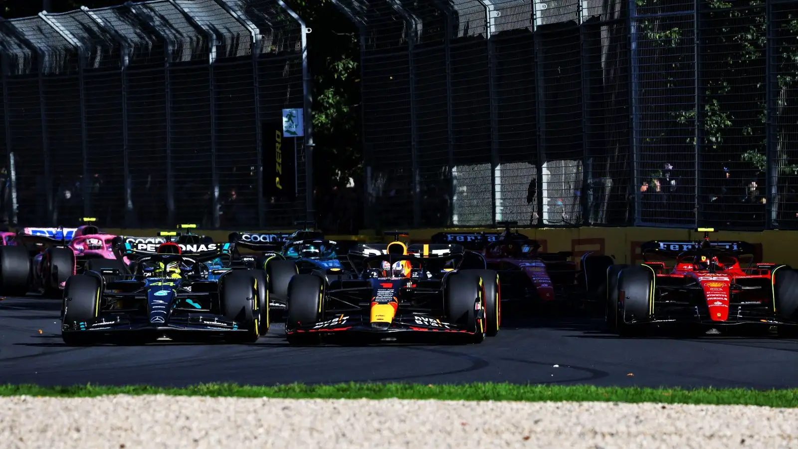 Mercedes' Lewis Hamilton overtakes Max Verstappen into Turn 3 at the Australian Grand Prix. Melbourne, April 2023.