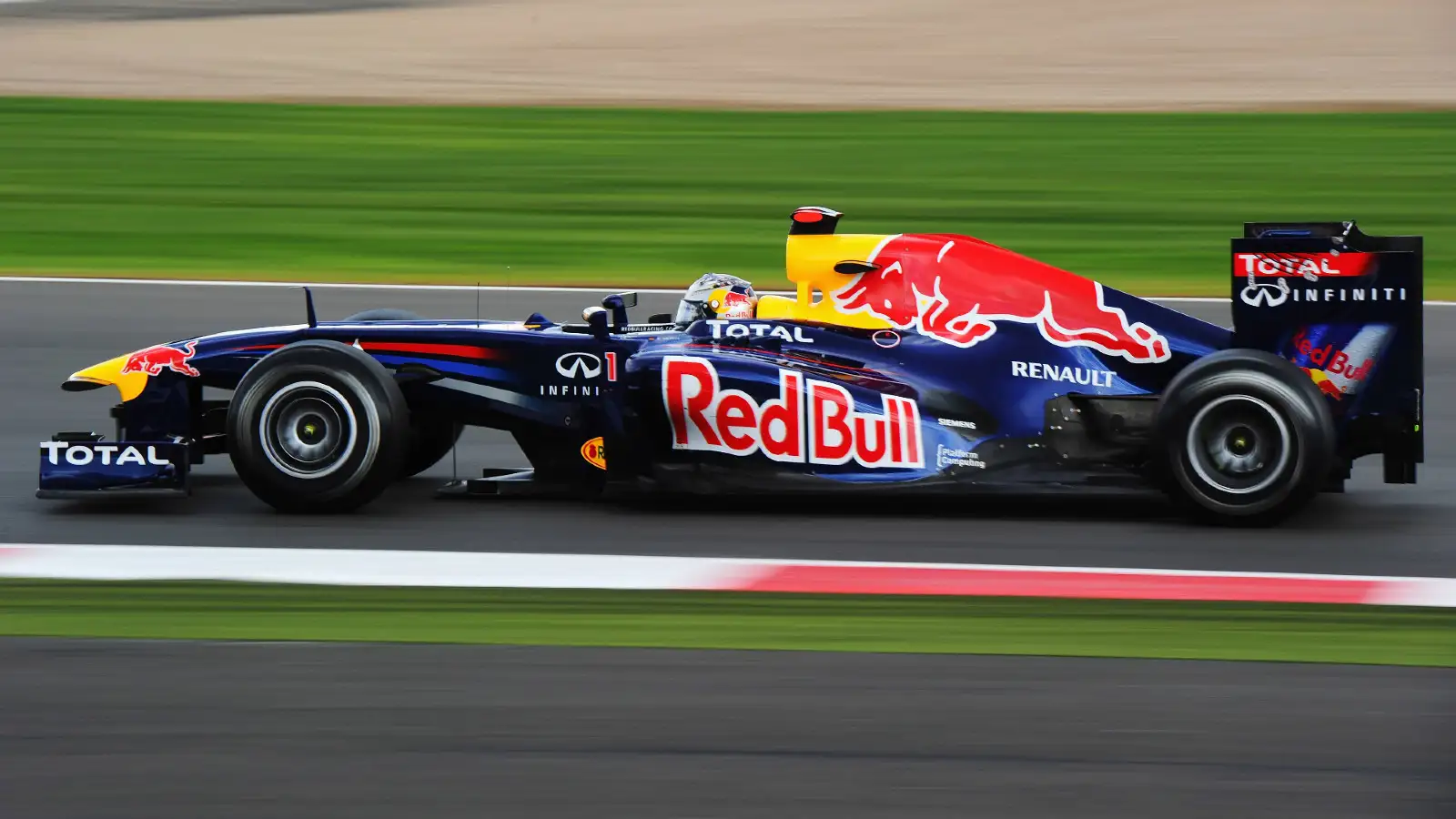 Red Bull's Sebastian Vettel on track racing at the 2011 British Grand Prix. Silverstone, July 2011. rule changes