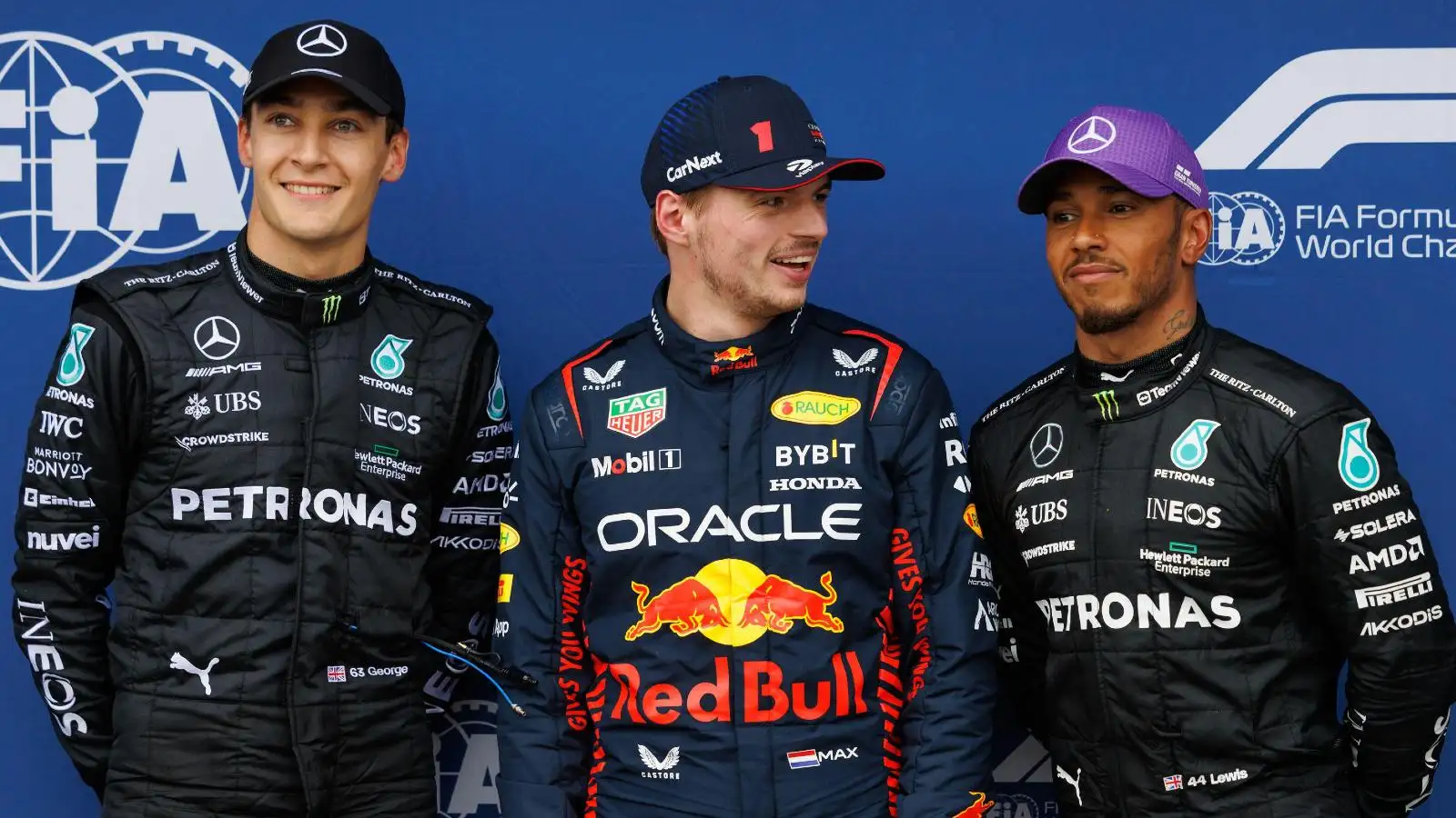Max Verstappen laughs next to George Russell and Lewis Hamilton. Melbourne, April 2023.