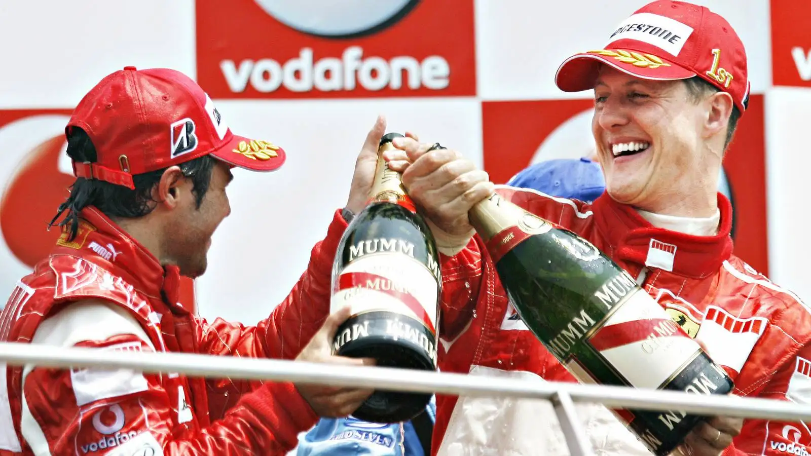 Felipe Massa and Michael Schumacher, Ferrari, celebrate. United States, July 2006.