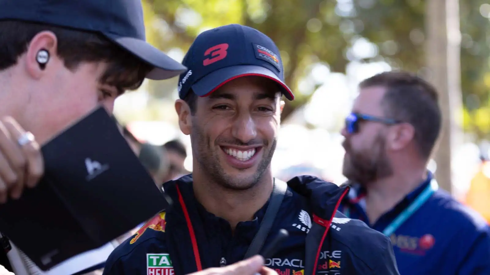 Daniel Ricciardo smiles with a fan. Australia April 2023.