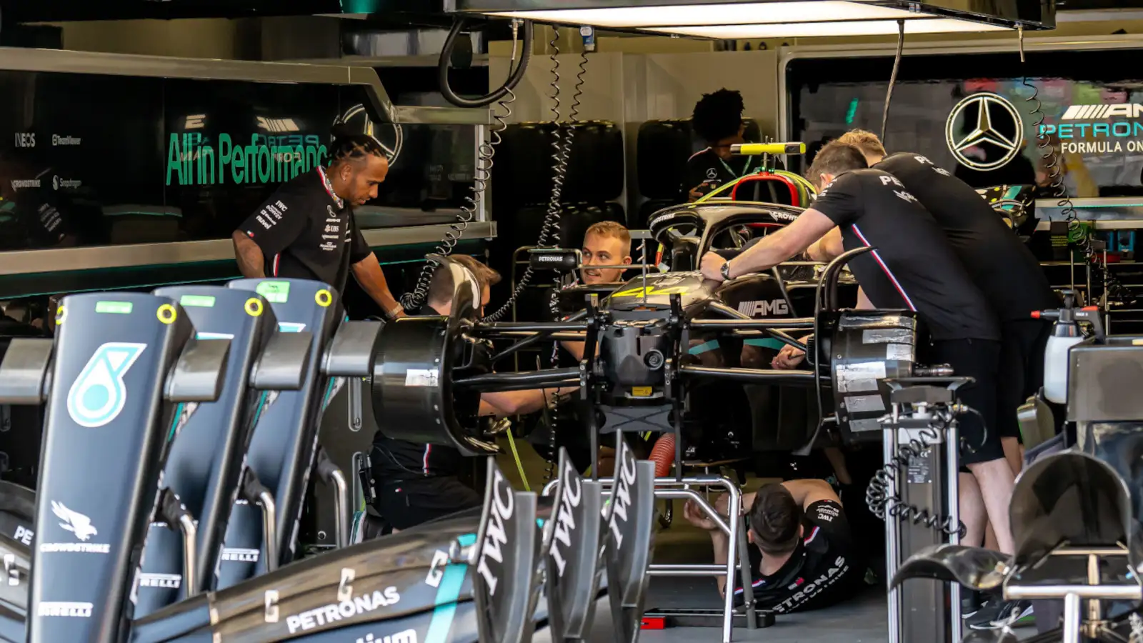 Lewis Hamilton speaking to his mechanics in the Mercedes garage. Azerbaijan April 2023