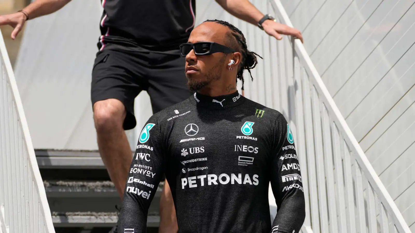 Lewis Hamilton walks down stairs. Baku April 2023.