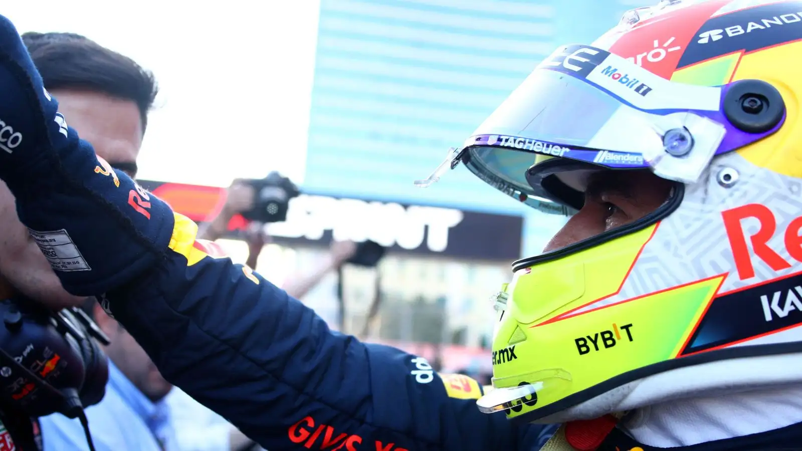 Sergio Perez is congratulated by Red Bull mechanics after winning the Azerbaijan Grand Prix sprint race. Baku, April 2023.