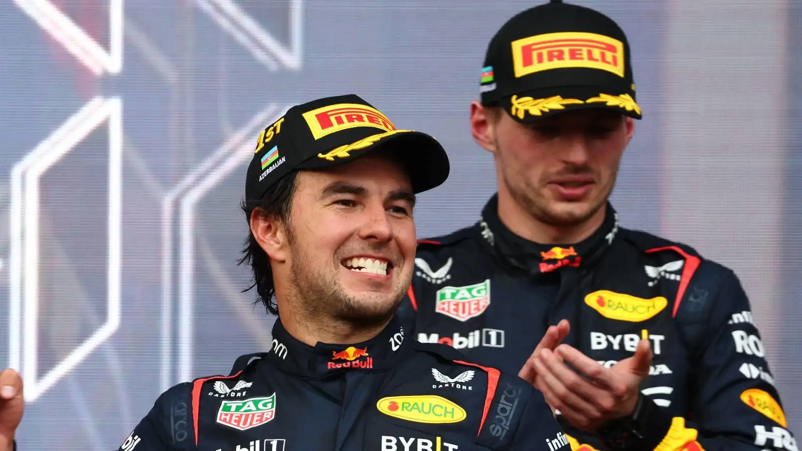 Max Verstappen applauds Red Bull team-mate Sergio Perez. Azerbaijan, April 2023.