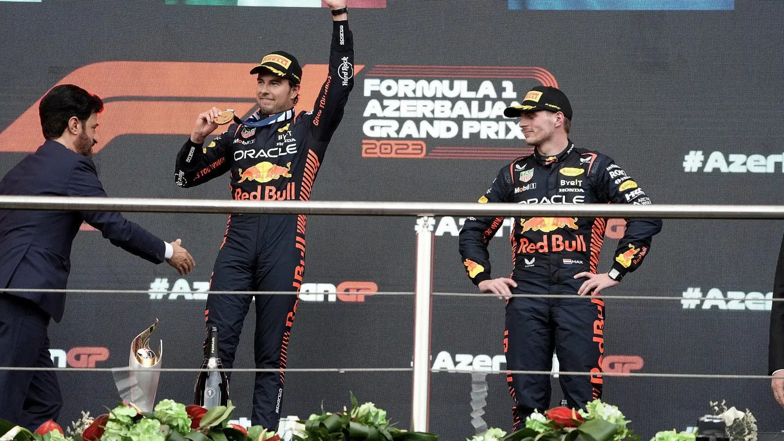Red Bull's Sergio Perez and Max Verstappen on the podium at the Azerbaijan Grand Prix. Baku, April 2023.