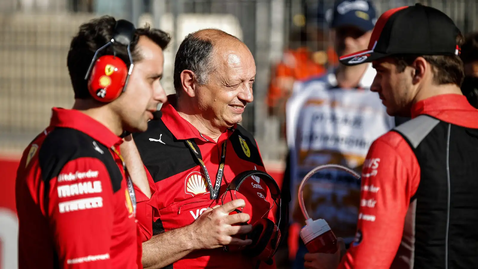 Ferrari team principal Fred Vasseur chats with Charles Leclerc on the grid at the Azerbaijan Grand Prix. Baku, April 2023.