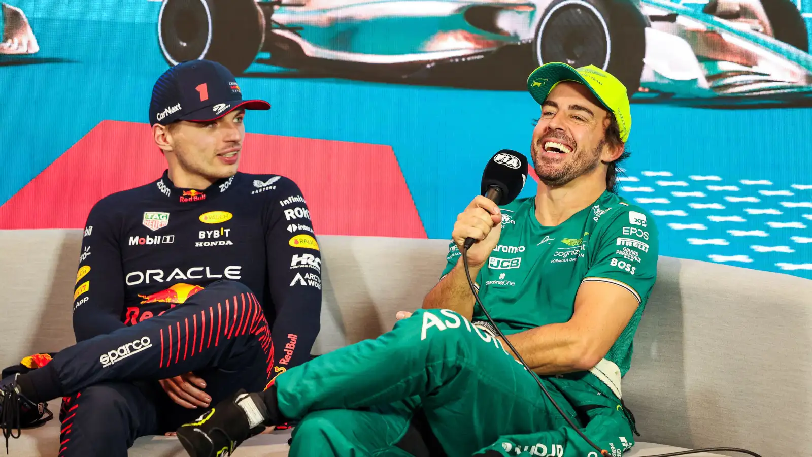 Fernando Alonso and Max Verstappen laughing in the post race press conference. Miami May 2023