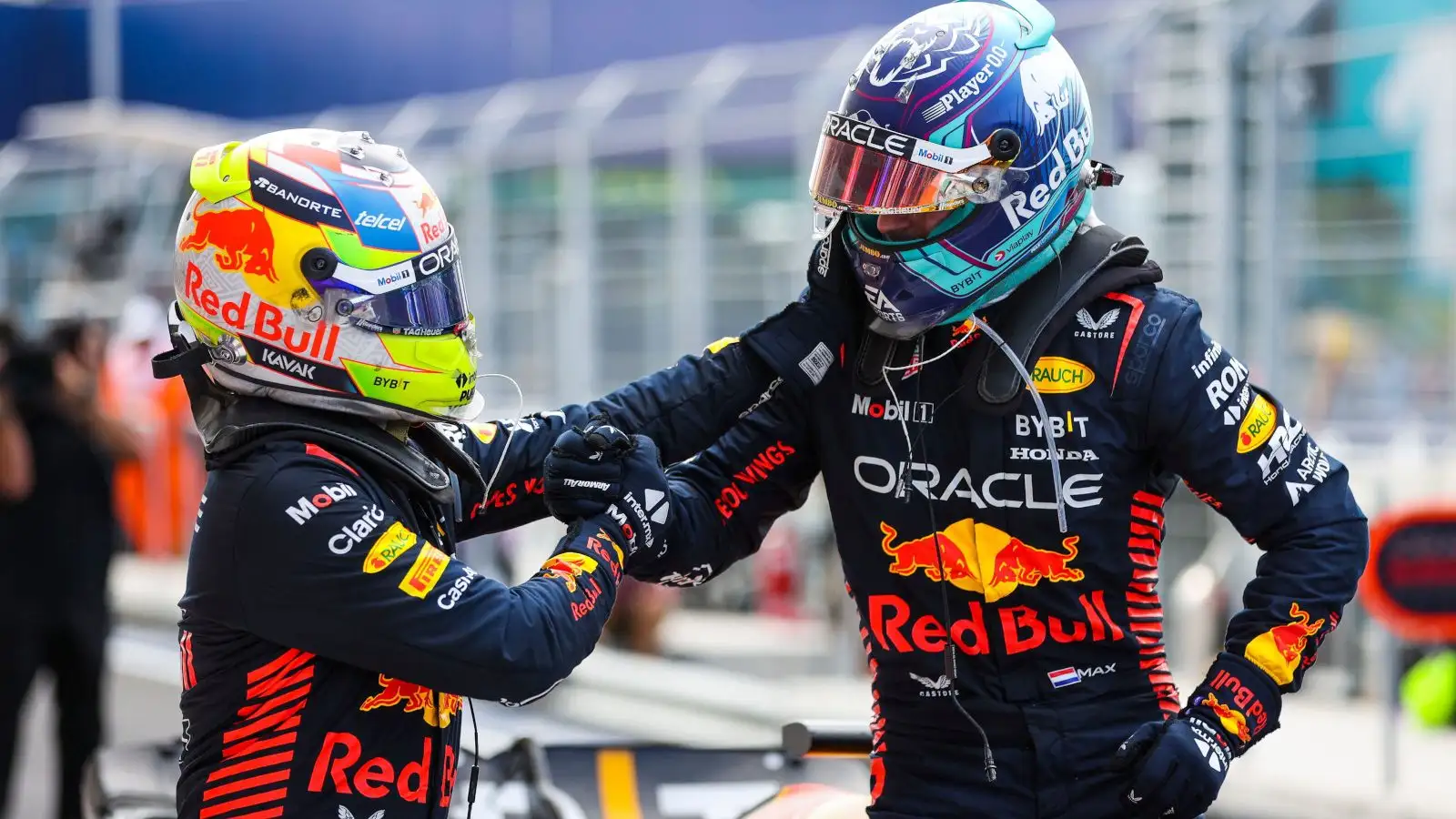 Sergio Perez goes to congratulate race winner Max Verstappen. Miami May F1 2023