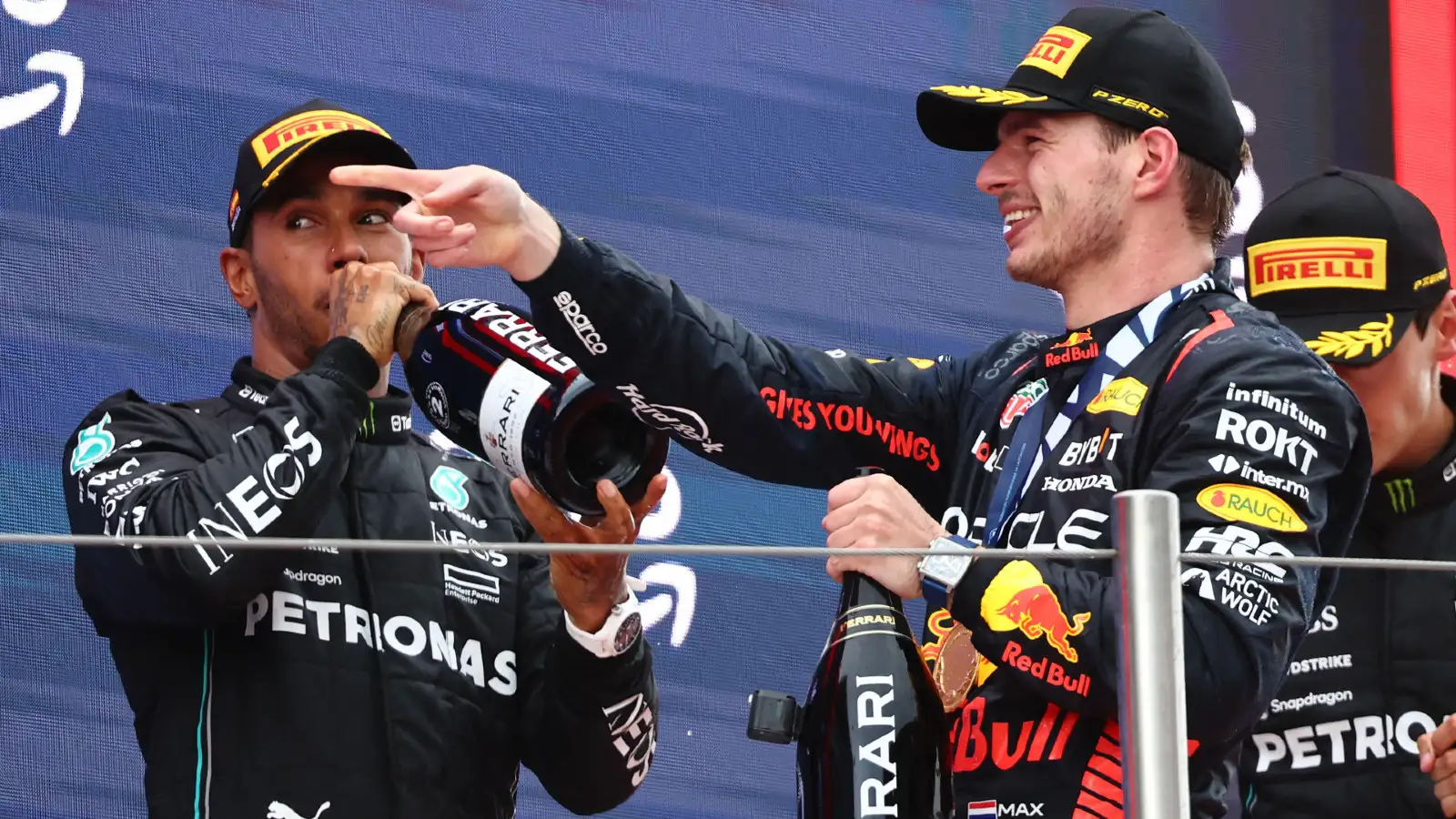 Mercedes' Lewis Hamilton and Red Bull's Max Verstappen on the podium at the Spanish Grand Prix. Barcelona, June 2023.