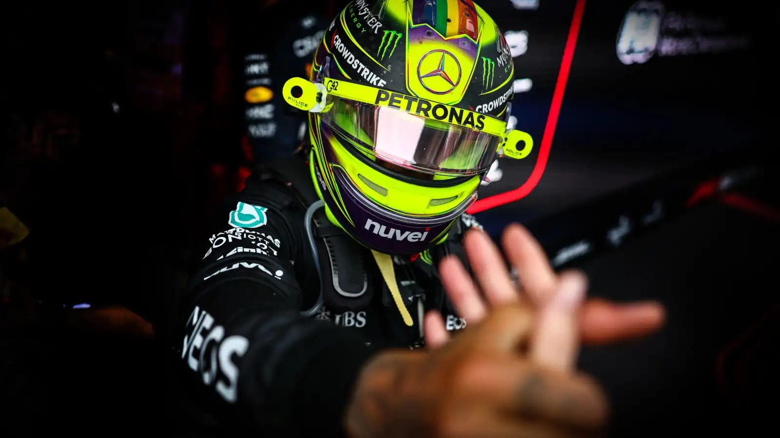 Lewis Hamilton reaches out to shake hands. Spain June 2023