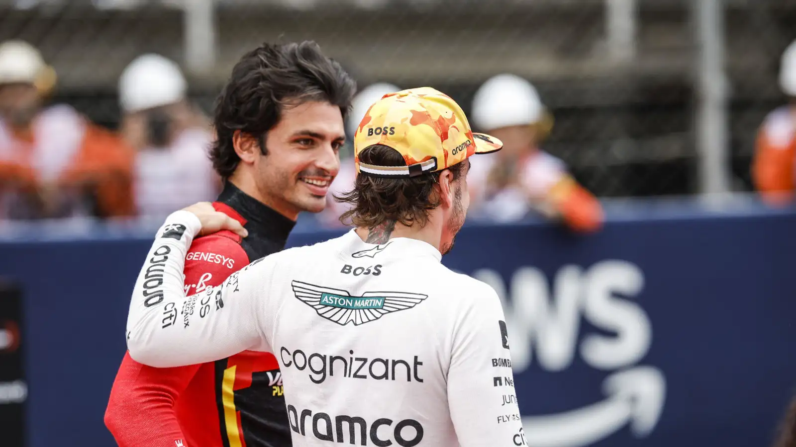 Carlos Sainz and Fernando Alonso hugs and smiles on the grid. Spain June 2023